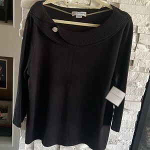 Sag Harbor long sleeve black sweater with a hint of sparkle. Rhinestone at neck